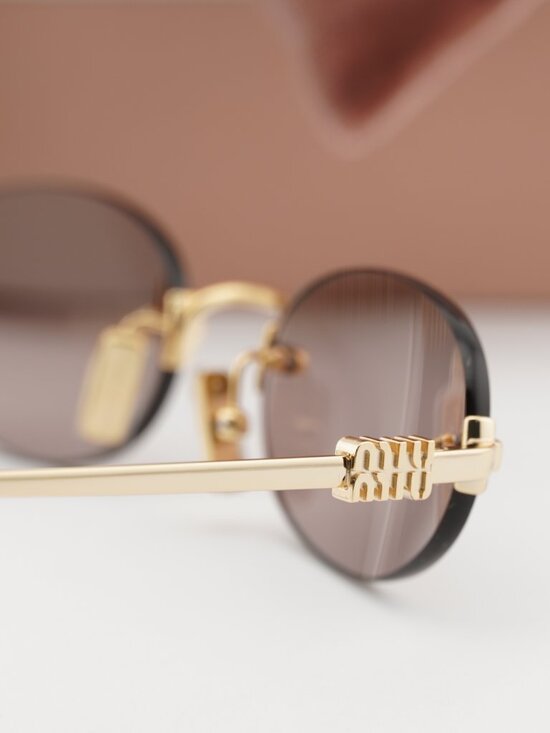 Miu Miu MUA54S 5AK20I Oval Rimless Sunglasses – Gold / Purple Brown main image 10